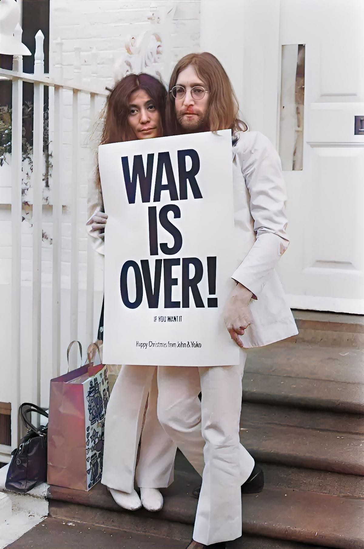John Lennon and Yoko Ono with a sign saying “WAR IS OVER! IF YOU WANT IT Happy Christmas from John & Yoko”